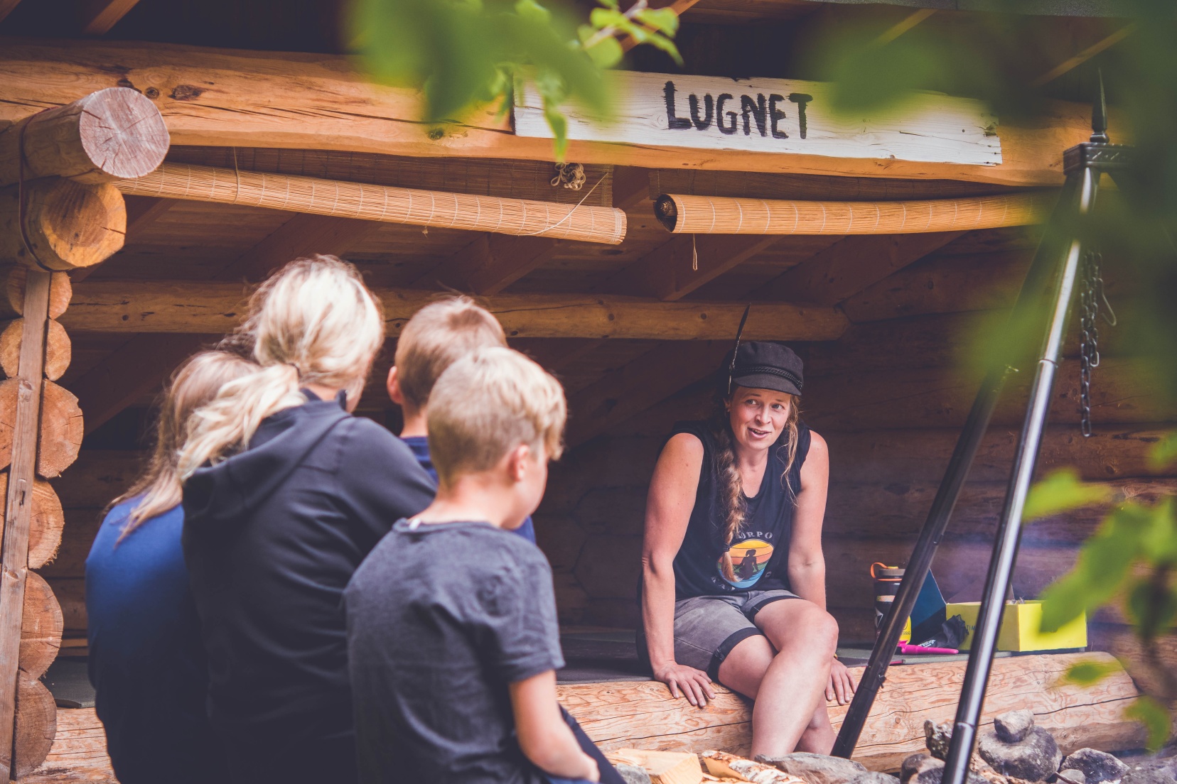 People sitting by a Laawu in Naawa Nature Camp on Korpo